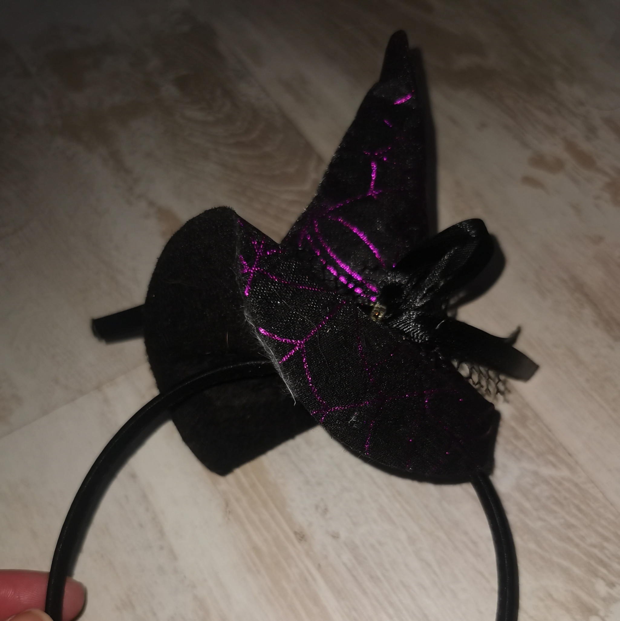 Tiny purple and black witch hat on alice band